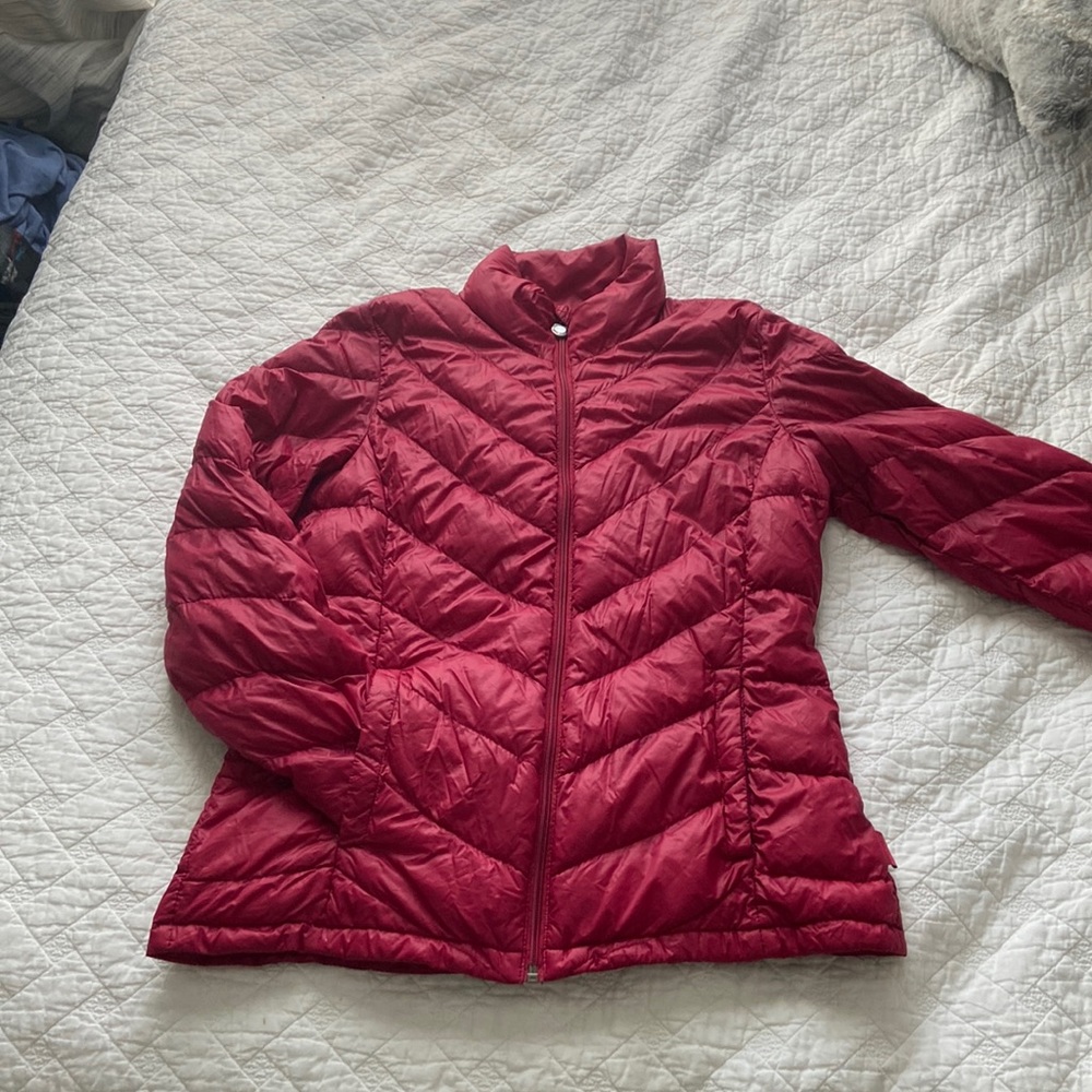 A red puffy Calvin Klein jacket
